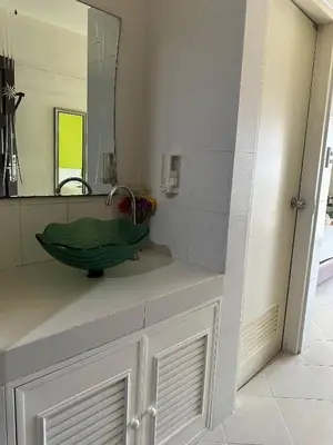 a bathroom with a sink and a mirror at Private Apartment in city center and near BTS in Bangkok