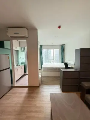 a large room with a kitchen and a bed at Bangson Monthly rental apartment in Bang Su