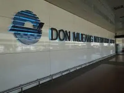 a sign on the side of a building with a sign on the wall at Asia Don Mueang Bangkok Condominium in Nonthaburi