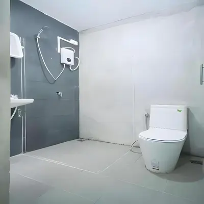 a bathroom with a toilet and a shower stall at XX GO INN Silom - Bangrak BTS St Louis in Yan Nawa