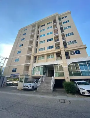 a large building with cars parked in front of it at 1 BR 5 Mins BTS Bearing 7-11 and Lotus in Ban Khlong Samrong