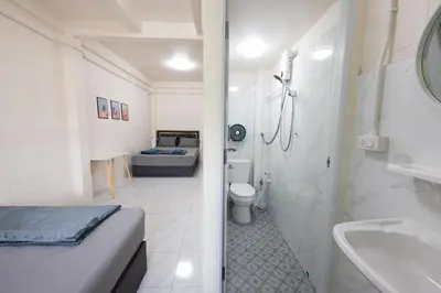 a bathroom with a bed and a toilet and a sink at ดอนเมือง 308 Near DMK Airport BTS Wat PhraSi in Bang Khen