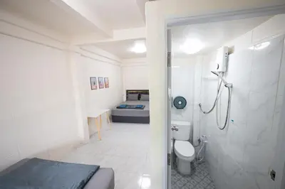 a bathroom with a shower and a toilet and a bed at ดอนเมือง 308 Near DMK Airport BTS Wat PhraSi in Bang Khen