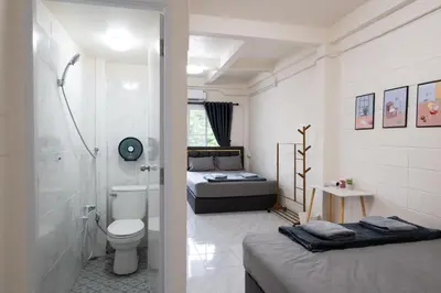 a bathroom with a toilet and a shower and a bed at ดอนเมือง 308 Near DMK Airport BTS Wat PhraSi in Bang Khen