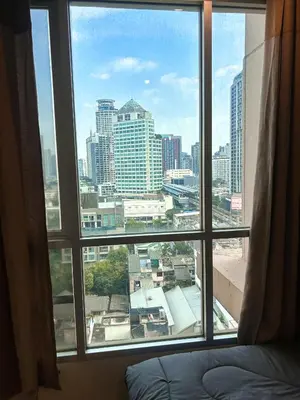 a view of a city skyline from a window at Luxury Apt BTS EKKAMAI with pool sauna gym in Bangkok