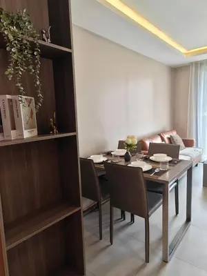 a dining room with a table and chairs at Modern 2BR-3 Mins Walking Distance to BTS Thonglor in Bangkok