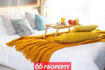 a bed with a table with corn on it at Long-Stay High Floor Apartment, Bangna, Near BTS, Malls in Bang Chak