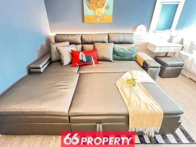 a large brown couch in a living room at Long-Stay High Floor Apartment, Bangna, Near BTS, Malls in Bang Chak