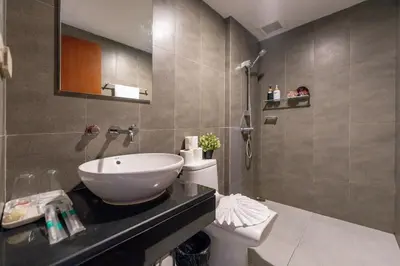 a bathroom with a sink and a toilet at Lucky 808 2BedRoom 100sqm BTS Chidlom in Bangkok