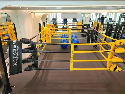 a gym with blue balls in a boxing ring at Quiet apartment with pool close to MRT station in Bangna