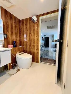 a bathroom with a toilet in a room at Charming 2-Bedroom Apartment in ON-NUT, Bangkok in Amphoe Phra Khanong