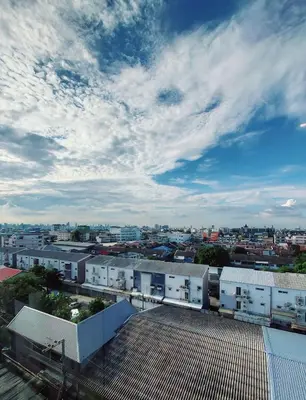a view of a city from the roof of a building at Charming 2-Bedroom Apartment in ON-NUT, Bangkok in Amphoe Phra Khanong