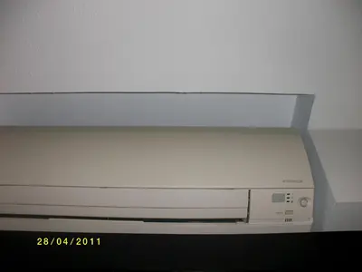 a dvd player sitting on top of a television at Sukhumvit 81 Condo - C in Bangkok