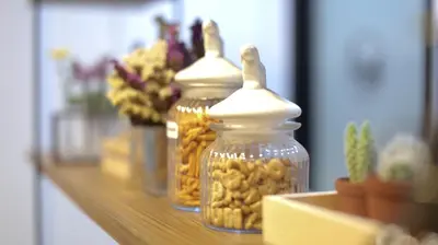 a row of glass jars filled with peanuts on a shelf at Lamurr Sukhumvit 41 in Bangkok