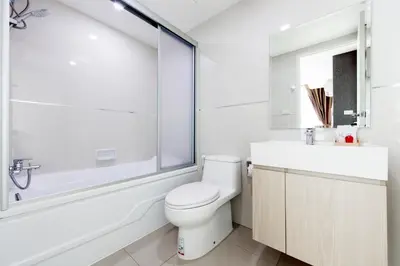 a bathroom with a toilet and a sink and a shower at Like Sukhumvit 22 in Bangkok