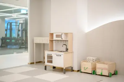 a toy kitchen with a sink and a microwave at Maison Hotel Bangkok in Bangkok
