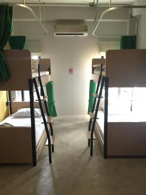 a group of bunk beds in a room at Bed@Town Hostel in Bangkok