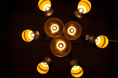 a bunch of lights hanging on a wall at KENCOZY accommodation in Bangkok