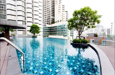 a large swimming pool on top of a building at Luxury Suite @ BTS Nana in Bangkok