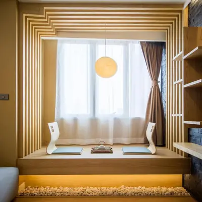 a window with a window seat in front of a window at Zenniq in Bangkok