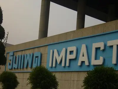 a building with a sign on the side of it at T8 Guest House Don Mueang Challenger in Bangkok