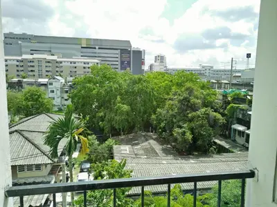 a view of a city from a balcony at JL Bangkok Hotel in Bangkok