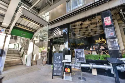 a store front of a building with a restaurant at Sukhumvit Suites Hotel in Bangkok