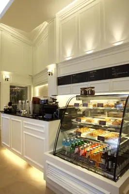 a display case with a lot of food and drinks at Khaosan Palace Hotel in Bangkok