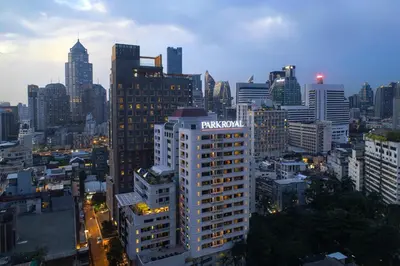 a view of a city skyline with a tall building at PARKROYAL Suites Bangkok in Bangkok