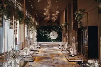 a long hallway with tables in a building at Grand Richmond Stylish Convention Hotel in Nonthaburi