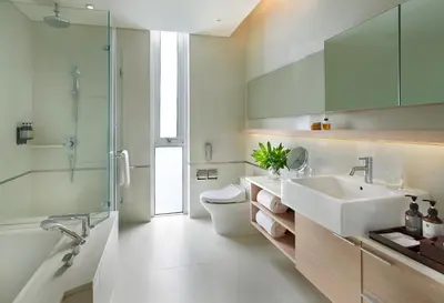 a bathroom with a sink and a toilet and a shower at Somerset Sukhumvit Thonglor Bangkok in Bangkok