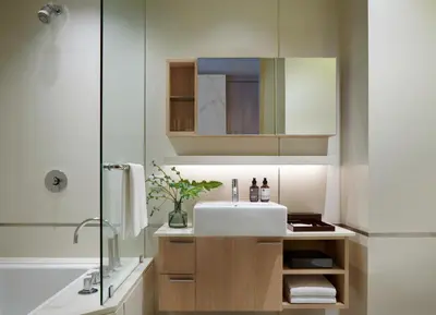 a bathroom with a sink and a shower at Somerset Sukhumvit Thonglor Bangkok in Bangkok