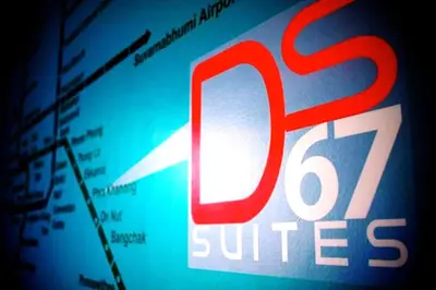 a close up of a sign that says j switches at Ds67 Suites in Bangkok