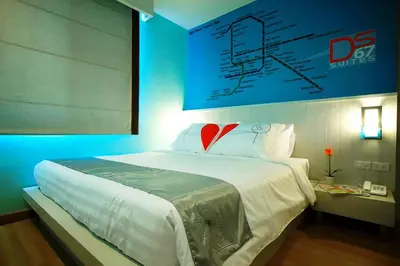 a bedroom with a bed with a red heart on it at Ds67 Suites in Bangkok