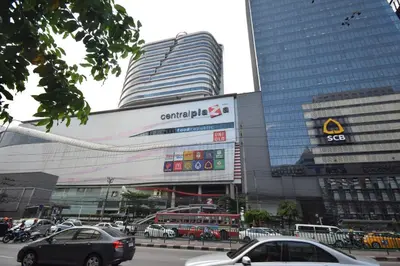 a large building with cars parked in front of it at Blissotel Ratchada in Bangkok