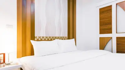 a bedroom with two white beds and a window at Sunset Residence Pinklao in Bangkok