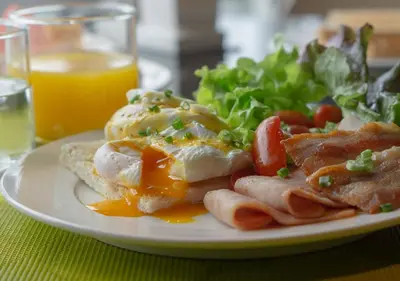 a plate of breakfast food with eggs toast and a salad at Modena by Fraser Bangkok in Bangkok