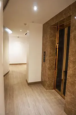 an empty room with a hallway with a wall at Aspira G Sukhumvit 33 in Bangkok