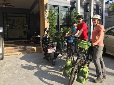 a group of people standing next to their bikes at Hide Bangkok Hostel in Bangkok