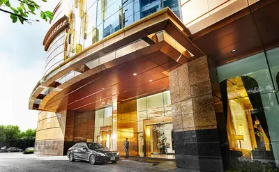 a car parked in front of a building at Grande Centre Point Sukhumvit 55 Thong Lo in Bangkok