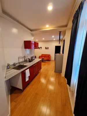 a kitchen with a sink and a counter top at Maderla in Bangkok