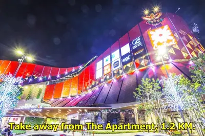 a building with colorful lights on it at night at T3 Residence in Bangkok