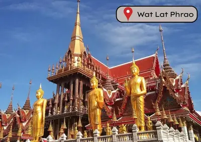 a building with gold statues in front of it at The President Hotel at Chokchai 4 in Bangkok