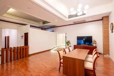 an office with a conference room with a table and chairs at The President Hotel at Chokchai 4 in Bangkok