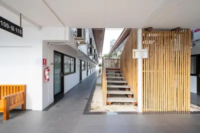 a hallway of a building with a staircase in it at The President Hotel at Chokchai 4 in Bangkok