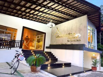 a building with a bike parked outside of it at ลีลาวดี รามอินทรา - Leelawadee Resotel Raminthra 23 in Bangkok