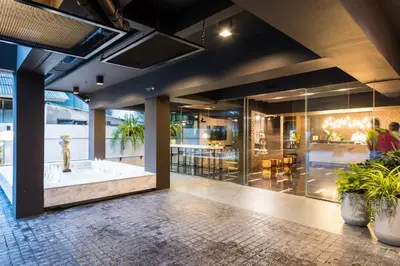 a lobby of a building with a bathtub at Fyn Hotel in Bangkok