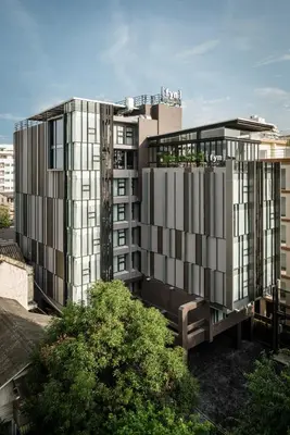an architectural rendering of a tall building in a city at Fyn Hotel in Bangkok