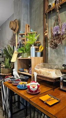 a table with plates of food on top of it at Hansa Bangkok House in Bangkok