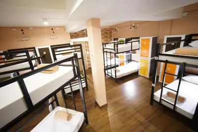 a group of bunk beds in a room at Urban Hostel Bangkok in Bangkok